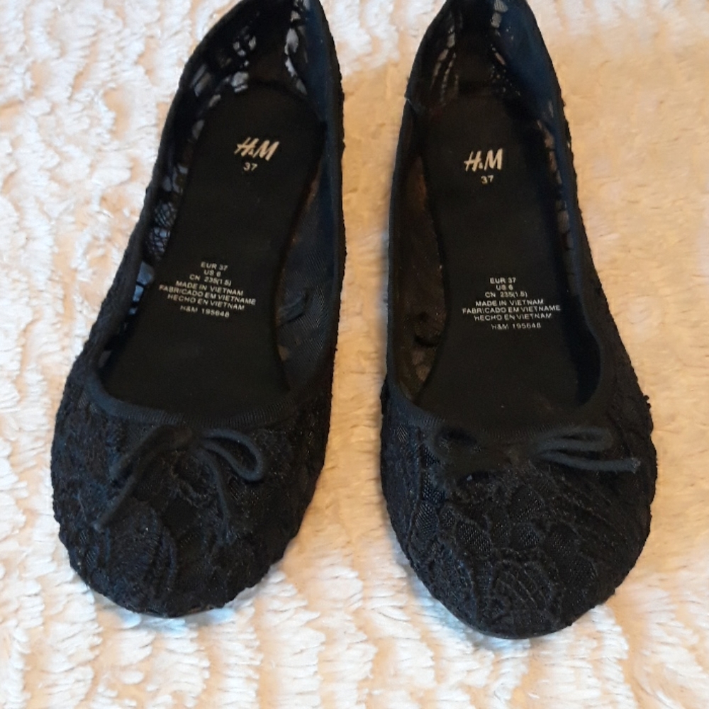 Black H&M flats.